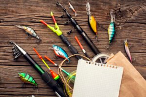 top-view-fishing-essentials-with-paper-bag-sheet-paper